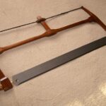 A 22" blade frame saw, salvaged mahogany, finished with button polish.