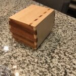 Pine/Sapele w/ geometric inlay. No lid. Will never open. Pet urn box for friend.