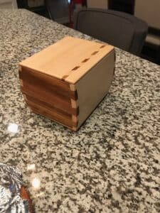 Pine/Sapele w/ geometric inlay. No lid. Will never open. Pet urn box for friend.