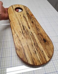 Not actually a cutting board, but more for serving cheese. Made this from spalted birch from the neighbourhood and reclaimed mahogany. Very interesting to make the edgeband by boiling the strip and shaping it around the piece!