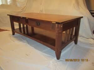 Arts and crafts style coffee table made of black walnut and Cumaru.