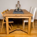 an oak dining table with breadboard ends and Y-stretchers