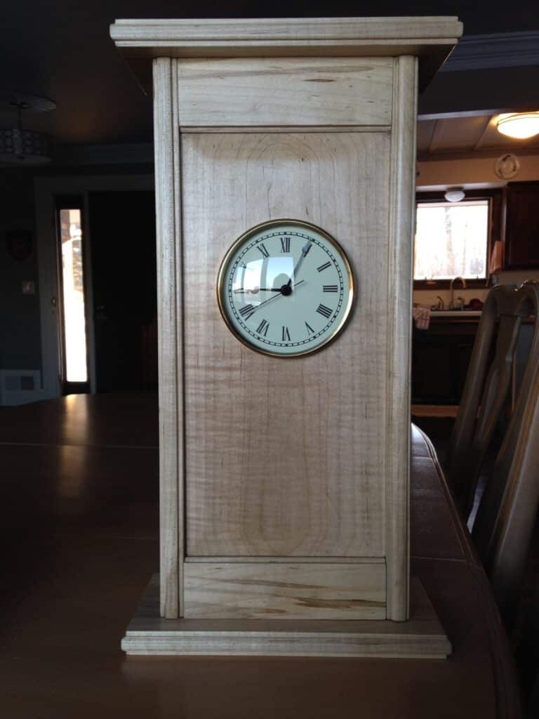 Christmas gifts for my daughters and their families. Matching wall clocks from black walnut and soft maple. Detailed with wooden molding planes.