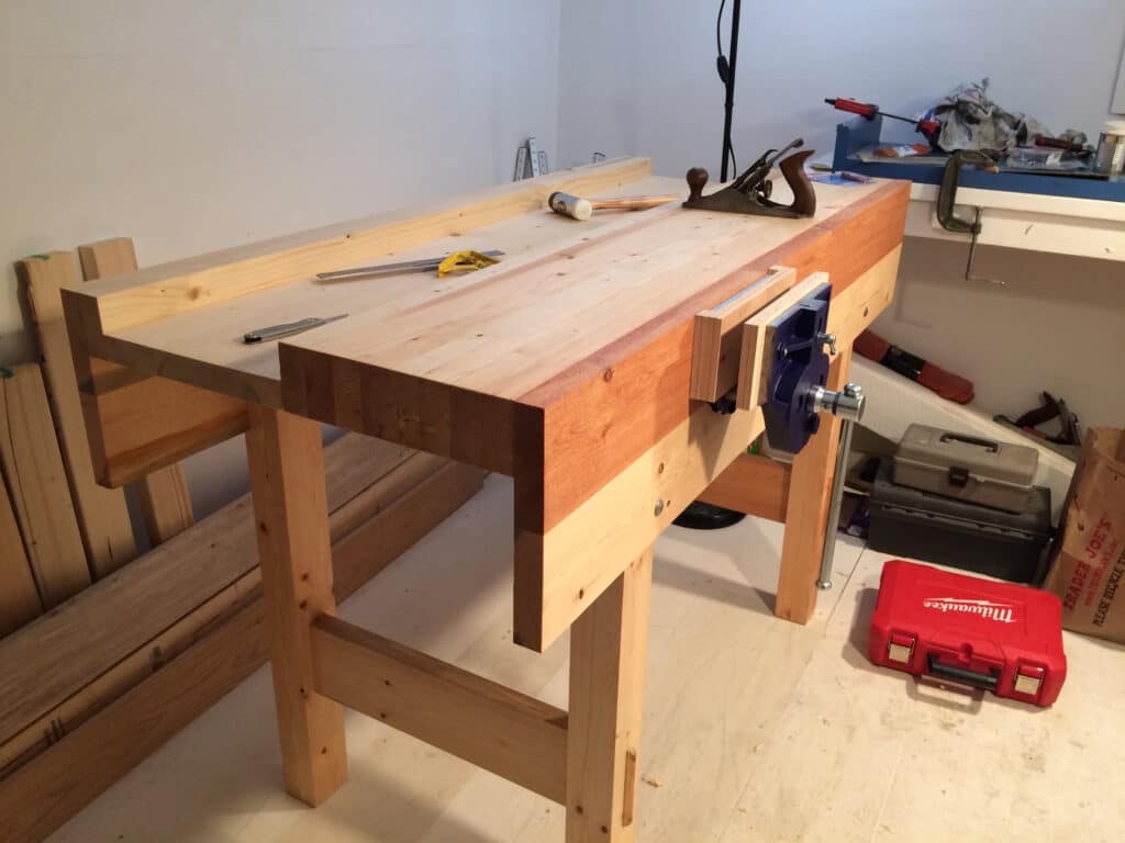 Just finished the workbench based on Paul's design! 5 feet long by 27 inches wide by 38 inches tall, made from western spruce with Veritas quick-release vise with plywood liner.