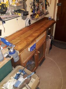 i had a 3ft bench which wasn,t big enough so i extended it to make a 6-8 ft bench using a pallet of wood then to top it of put plywood across the top then joined this to my old 3 ft bench which is handy as it has alot of space inside for tools etc, then i got some timber squared and milled the lengths of timber i think the timber is pine but im not to sure as the wood was given to me by a vicar ,and what a god send this was, as i now have the bench i have always wanted or there about,s as since watching paul laminate and the way he has made benches is something i admire, but for now im happy could do with half a ft in width but i dont have the space the length in total is 5ft towards the front and 8ft at the back i had to make it smaller at the front otherwise i wouldnt get out of the front door,but thank you paul for everything you have shared i have learned so much from you in a short time its brilliant the way you explain everything and a lot of the tools i own is down to you explaining the good the bad and the ugly,i am now a record fan absolutely love record and sorby. any way here is pics of the bench. best wishes to paul sellers and every one on this fantastic site of knowledge