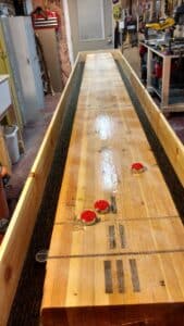 Shuffleboard table built from a reclaimed park shelter beam and pine.