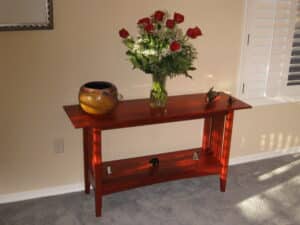 Craftsman style sofa table made out of paduak. It was put together with mortise and tenon joints.