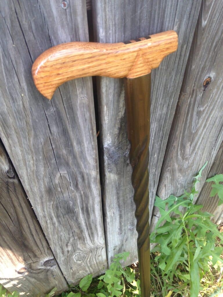 Red Oak handle with a Poplar staff. Oak was finished with Polyurethane and staff was finished with Linseed oil which turned it a dark olive color.