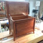 The blanket chest in hard maple with birdseye maple lid. The stain is General Finishes Brown Mahogany with oil-based polyurethane top coat.
