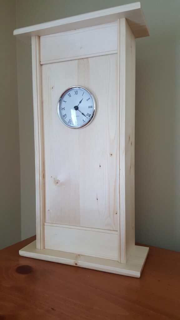 Made of white pine. This was a fun project and very rewarding. My wife wasn't fond of the base embellishments so i kept it simple. Finished with blonde shellac and wax.