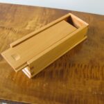Small Sliding Lid box, made from old wood from toolbox till. Note nail hole in bottom. Wood seems to be spruce or white pine.