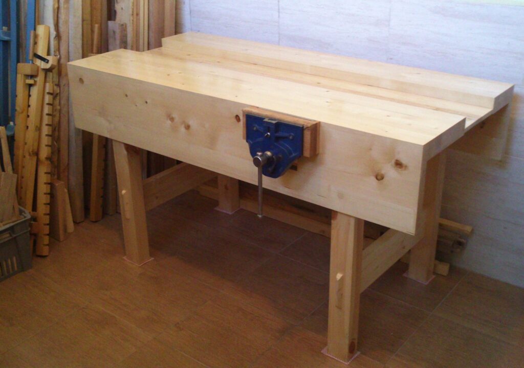 Here's my workbench. I made it from pine, finished it with polyurethane. It's really nice to finally have a solid workbench!