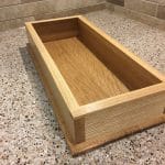 Chisel tray with ash sides (rift sawn) and a white oak bottom (quartersawn). Finished with shellac and wax. This was the first project that I made using my new Paul Sellers workbench!