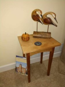 End table in cherry. Finished with Danish oil and wax. Shore birds carved by my grandfather.