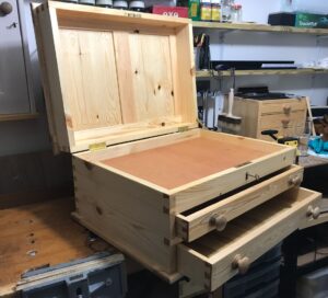 Toolchest built from pine and finished with Tung Oil. I treated myself to a Brusso box lid stay.