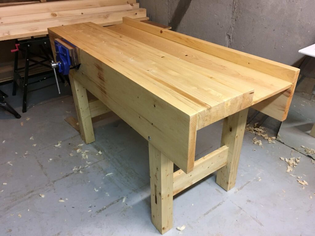 I made the new workbench and followed the design fairly closely. Made of SPF 2x4s and some eastern white pine for the aprons. It took so long to prepare all of the lumber with a handplane, but once that was done the bench came together fairly quickly. I love it!