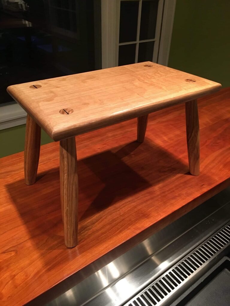 Foot stool made using Paul seller’s design and technique, quarter-sawn white oak from Kentucky with ebony wedges from Africa.