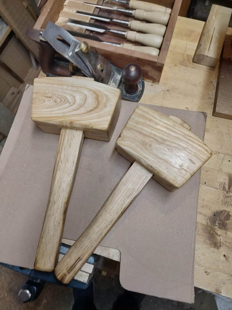 Two mallets. Head is Hickory. Handle is oak. Both fell across my driveway in a wind storm. One will be for the friend that came to help me saw the wood into pieces to get the car out of the garage.
