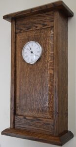 Oak Wall Clock. Number 5 of 5 now produced, this in American WHite Oak for the frame and English Oak for the panel. Stained in Georgian Dark Oak and finished with Pale Shellac and polished with Beeswax and Turpentine