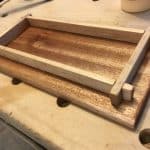 I made this wooden tray as Christmas gift for my sister's knitting needles and rings. The base is mahogany and the sides are maple. I finished with a coat of boiled linseed oil.