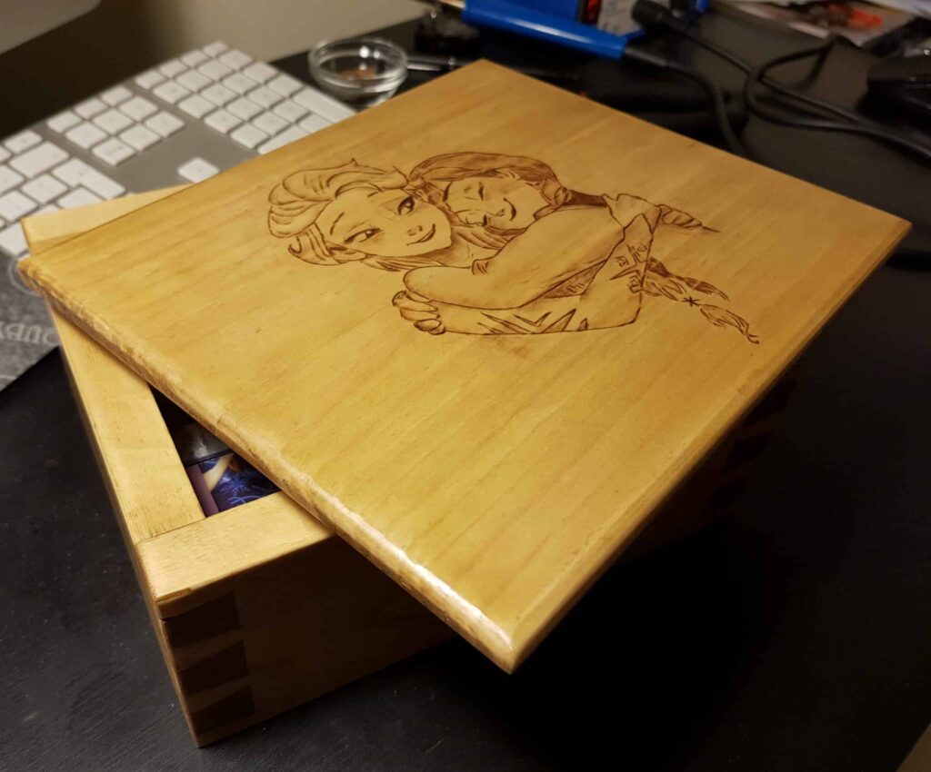 This box I made for my daughter's puzzles and it's constructed out of pallet wood. I done some pyrography on the top of the lid.
