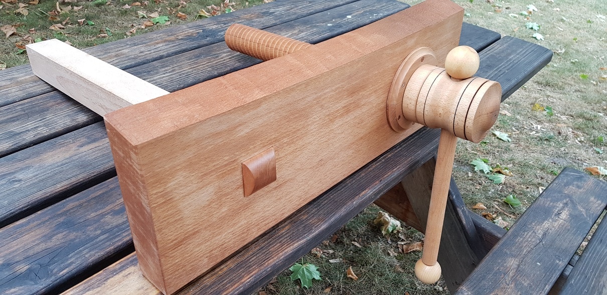 Front vise with wooden spindle.